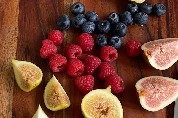 Halved figs with fresh berries